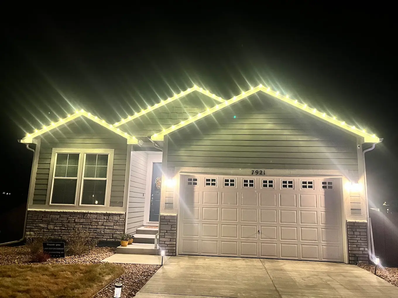 Warm white Christmas lights installation Front Range - elegant LED roofline lighting on single-family home, professional holiday display with clean modern aesthetic
